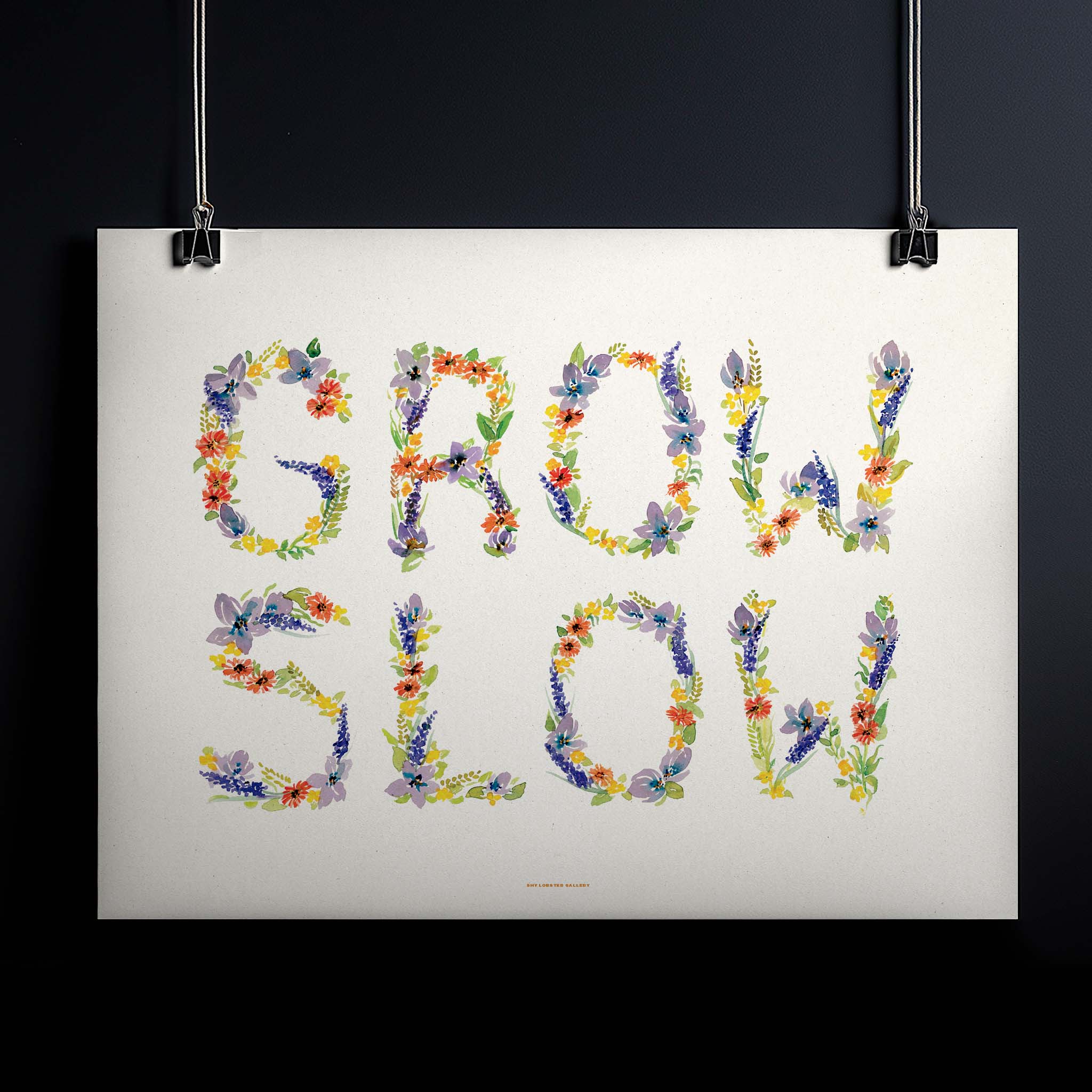 "GROW SLOW" typography poster featuring watercolor flowers for kids, a serene reminder to appreciate childhood and take life at a gentle pace. Perfect for nurseries and playrooms.