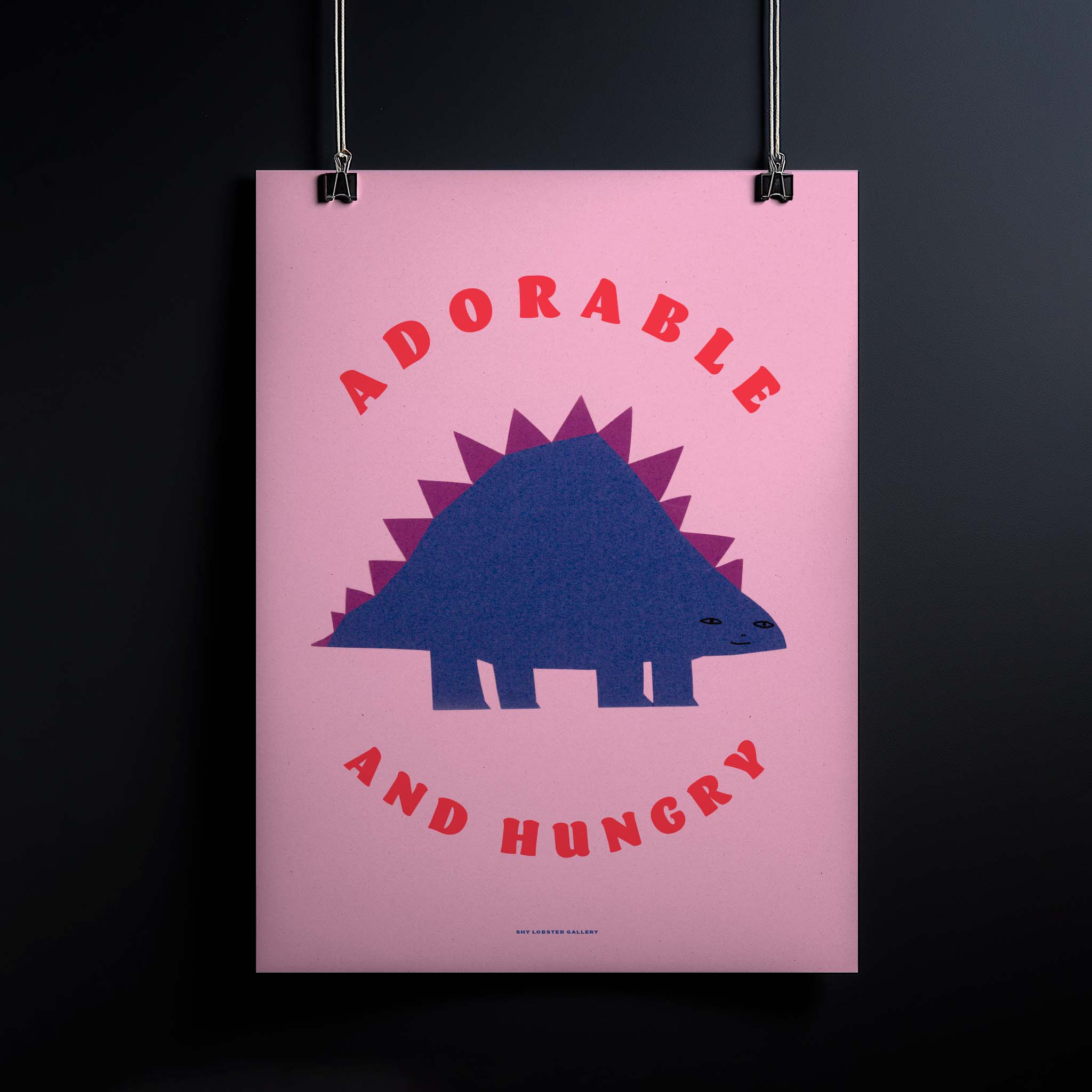 "Adorable and Hungry" – Playful kids poster featuring a cheeky purple dinosaur on a pink background, designed with simple paper cutouts. Perfect for adding fun and color to any child’s room.