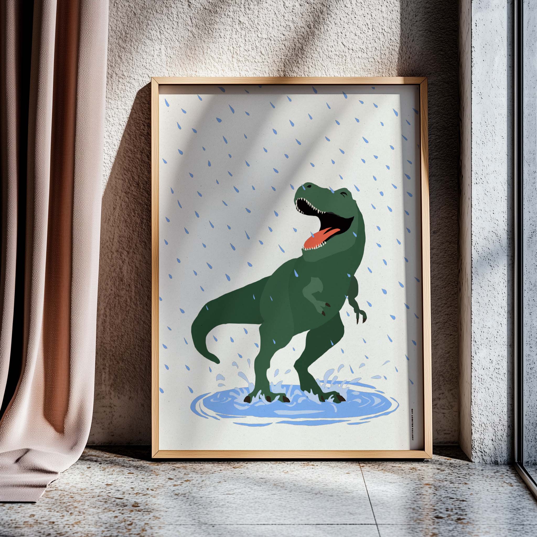 "Puddles" – Fun and playful graphic poster for kids featuring a happy T-Rex splashing in a puddle in the rain. Vibrant and joyful design, perfect for nurseries, playrooms, and kids' bedrooms, celebrating dinosaurs, laughter, and carefree childhood adventures. Poster in modern sleek wooden frame.